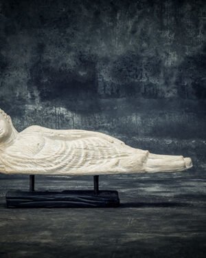 Sleeping Buddha on wooden stand