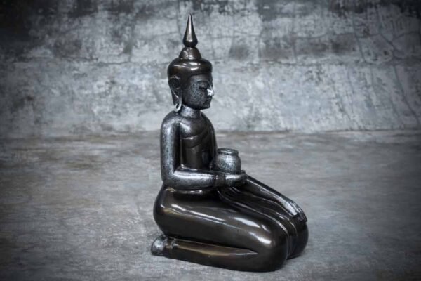 sitting Buddha holding bowl