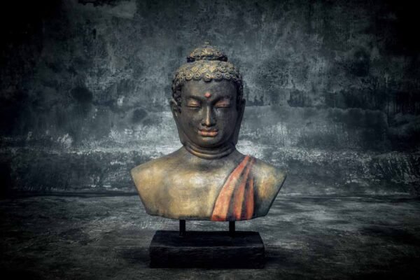 Buddha bust on stand