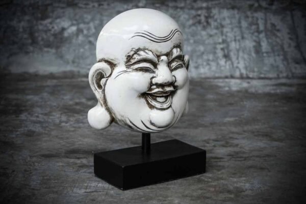 Laughing Buddha face on stand