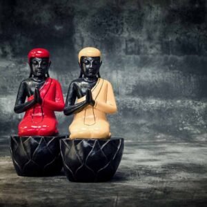 sitting buddha on pedestal
