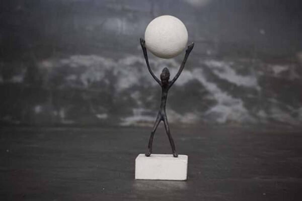 Abstract figure holding ball