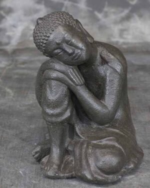 Buddha head resting on knee