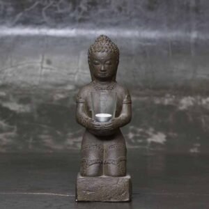 sitting Buddha on base with candle